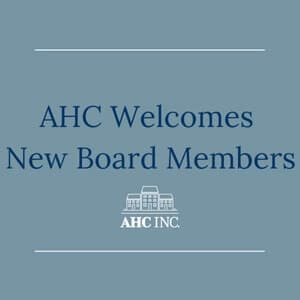 Blue graphic with the text AHC Welcomes New Board Members and a white line drawing of a building above the words AHC INC. at the bottom center.