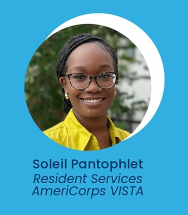 A woman with glasses and braided hair, wearing a yellow top, smiles in front of greenery. Text below reads: Soleil Pantophlet, Resident Services AmeriCorps VISTA. Blue and white circular background.