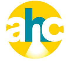 Logo for Affordable Homes & Communities featuring the letters ahc against a yellow circle, with a white beam of light under the h. The words AFFORDABLE HOMES & COMMUNITIES appear below in white text.