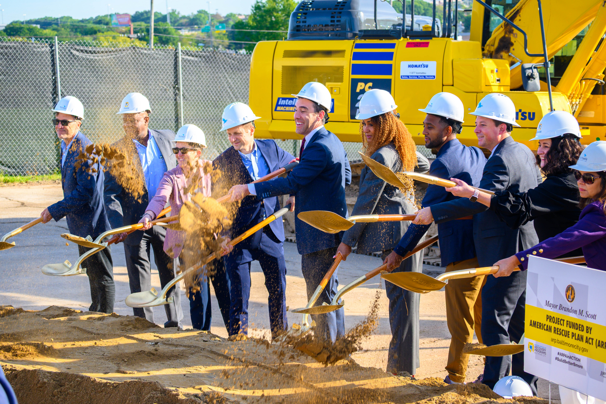 KP2A Groundbreaking - First Half A crew of people in suits breaking ground at a construction site
