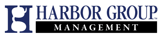 Navy blue logo with a stylized letter H featuring sunglasses inside a square, followed by the text HARBOR GROUP, representing Affordable Homes & Communities.