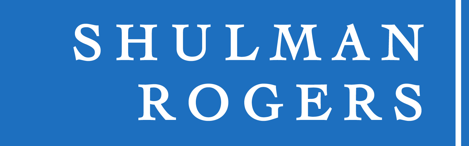 White text reading SHULMAN ROGERS in capital letters on a blue background, separated by a thin white vertical line on the right side, symbolizing strong Corporate Partnerships.